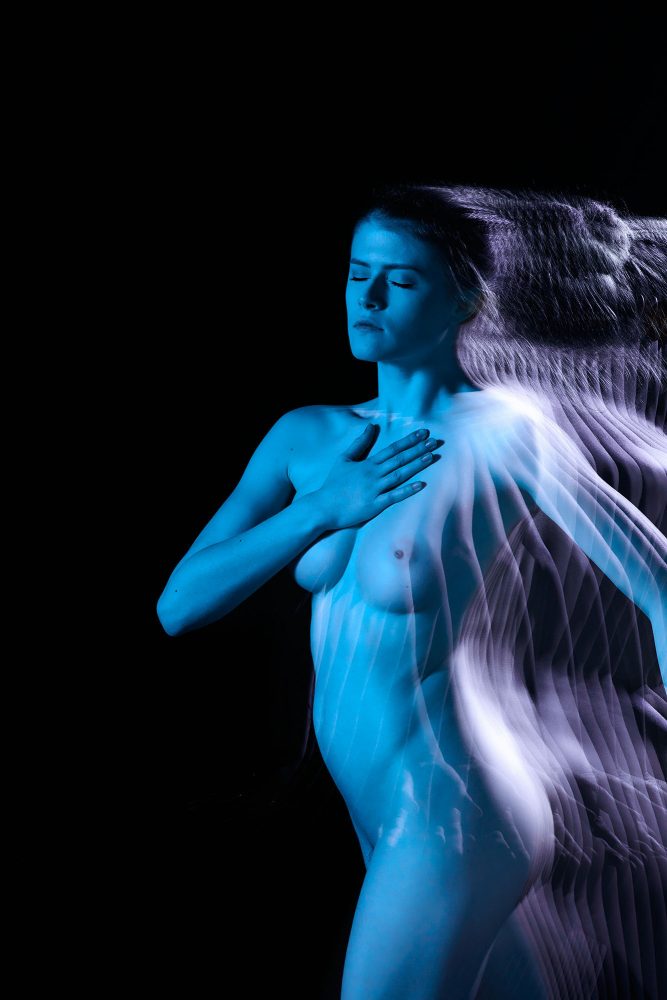 Nude woman in blue light    